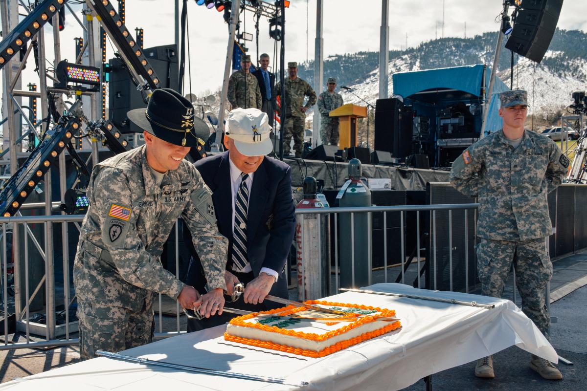 CPT Ryan Gibbons and Hugh Evans cut the ROTC's 100th birthday cake.